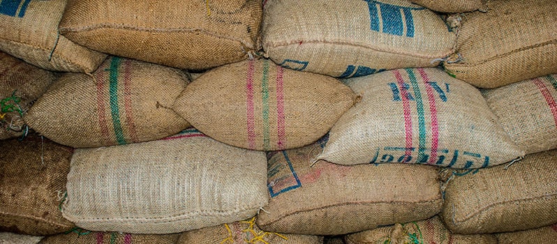 Bags of raw coffee beans from various locations