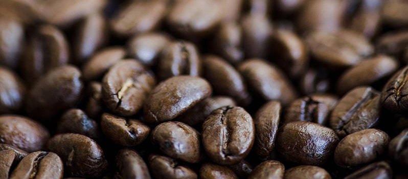 Pile of dark roasted organic coffee beans