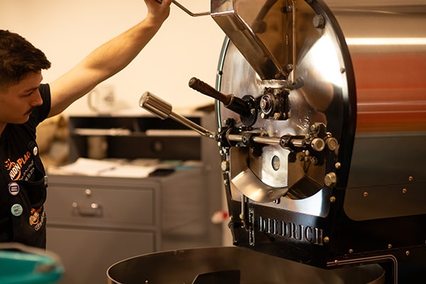 Nick roasting coffee beans at Union Place Coffee Roasters