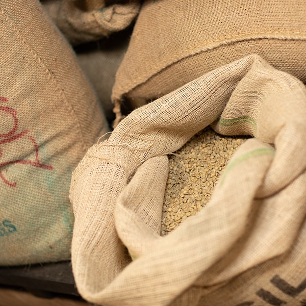 Burlap bags of raw beans at Union Place Coffee Roasters