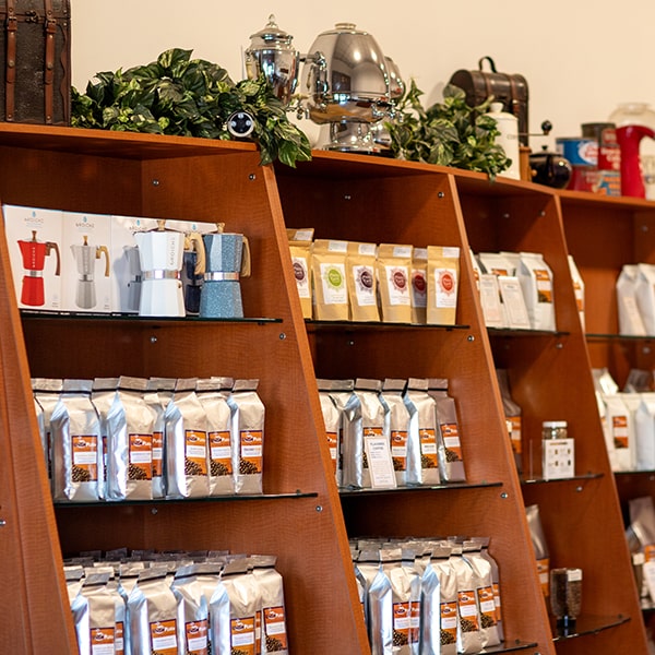 Shelves at Union Place Coffee Roasters filled with small batch roasted coffees