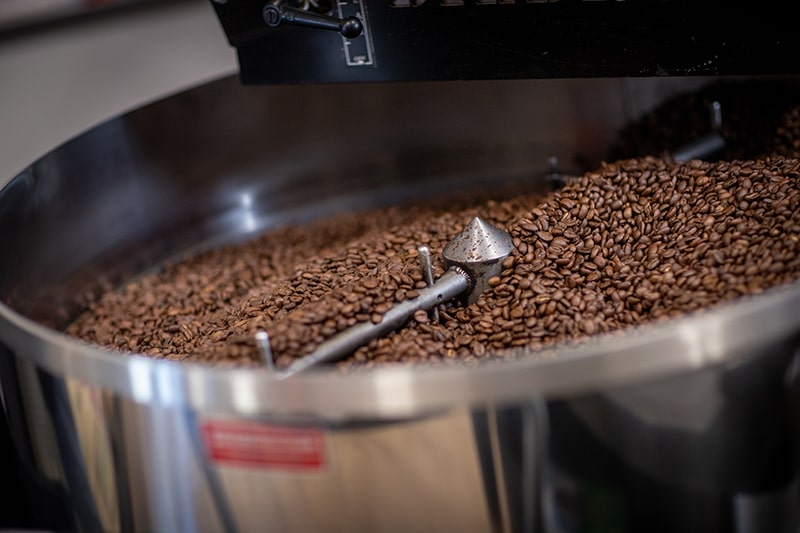 A small batch of coffee beans roasting in the Dietrich roaster