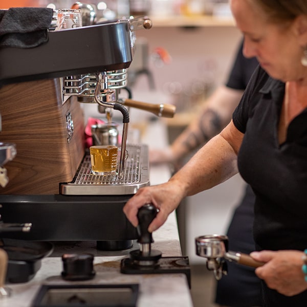 Laurie at Union Place Coffee Roasters making a shot of espresso