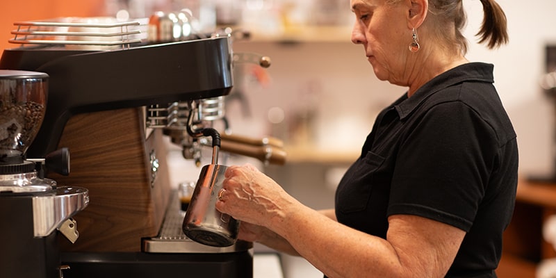 Laurie at the espresso machine at Union Place Coffee Roasters