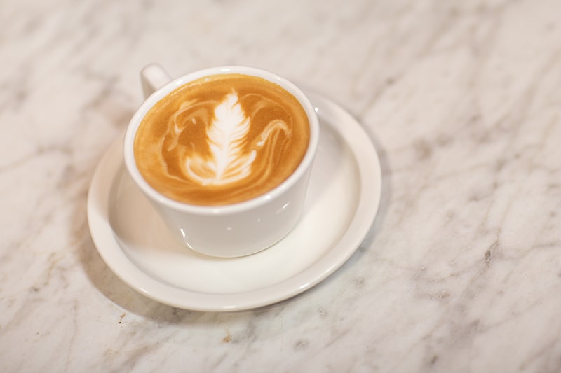 A latte with latte art drawn in the foam