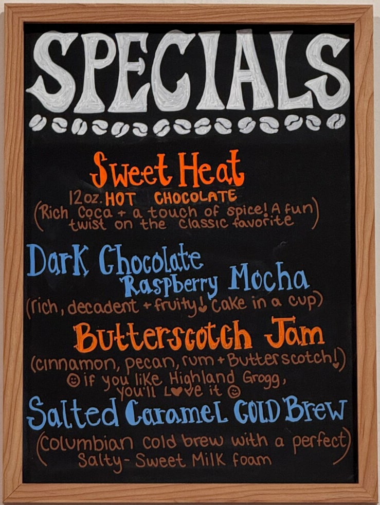 Chalkboard sign of the specialty drinks at Union Place Coffee Roasters