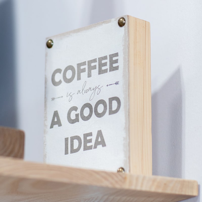 A wooden sign that says "Coffee is always a good idea"