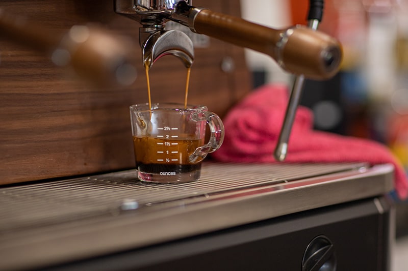 An expresso machine brewing a shot of espresso at Union Place Coffee Roasters